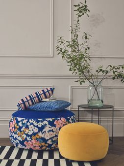 Joules Ashwicke velvet large round pattern footstool, and small velvet footstool in pumpkin, available exclusively at DFS