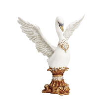 large white and gold swan statue
